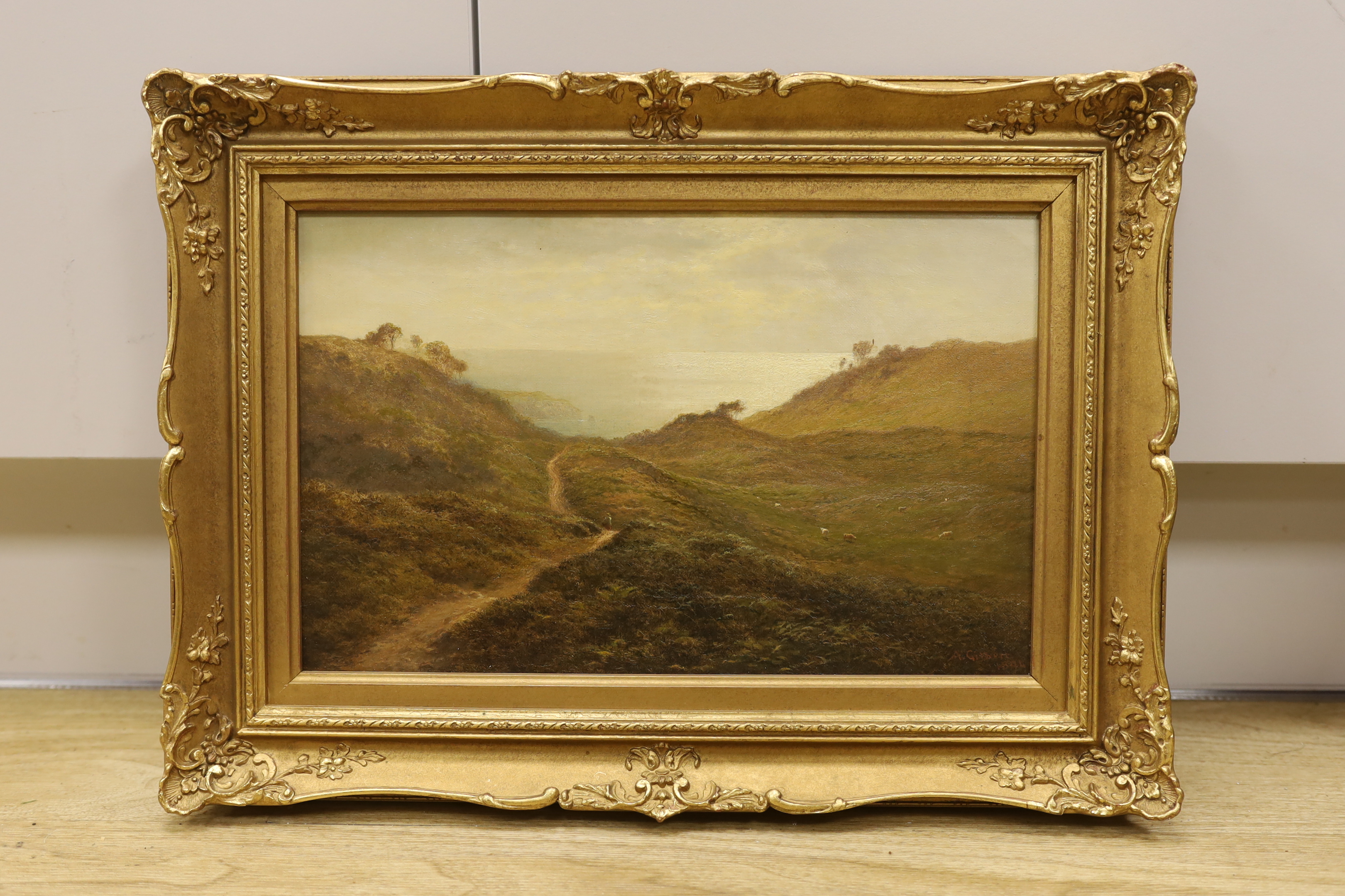 Arthur Gilbert (1819-1895), oil on canvas, Coastal landscape, signed and dated 1894, Windsor & Newton stamp verso, 21 x 34cm, ornate gilt framed